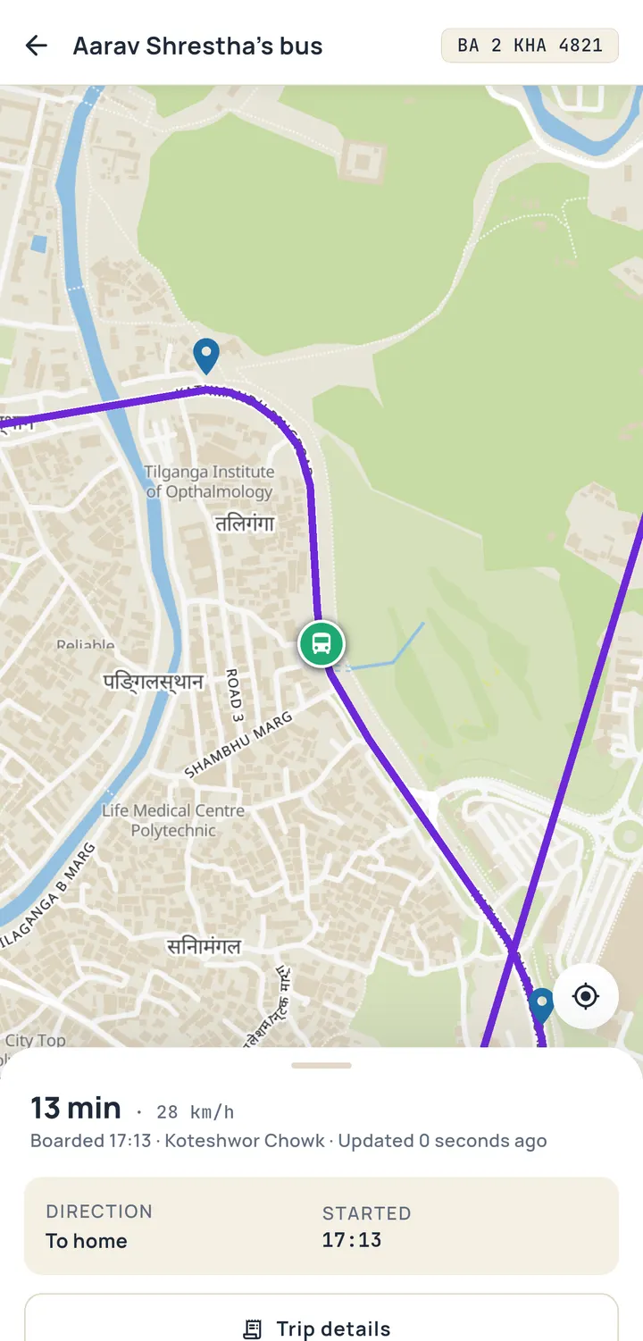 Parent app live map: the bus icon on a Kathmandu street map with the route drawn ahead of it, and a sheet reading 13 min, 28 km/h, boarded 17:13 at Koteshwor Chowk.
